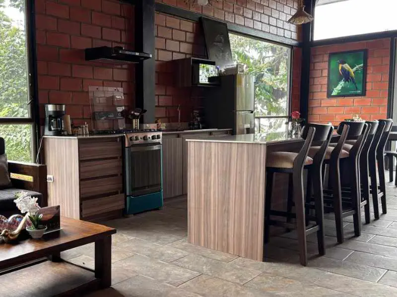 The Guest House at Mashpi Amagusa includes a kitchen with stove, oven, refrigerator, and coffee maker.